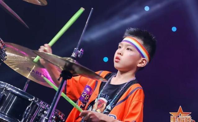 11岁广州少年敲鼓7年拿金奖，他如何用节奏征服星海舞台？