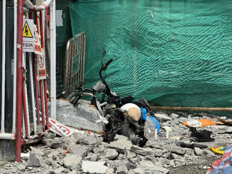 龙华一高层外墙大面积脱落砸损多辆电动车 所幸无人伤亡